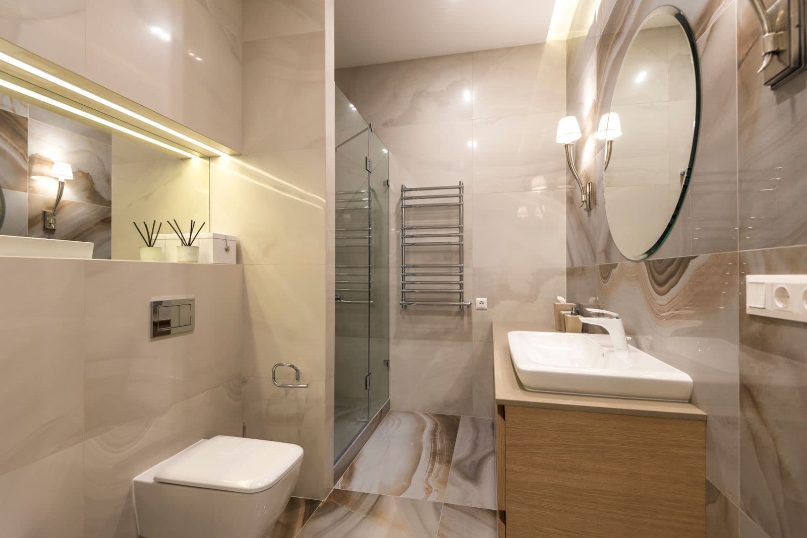stock photograph of a modern fitted bathroom suite with basin, toilet and shower. Licensed stock picture, not a photograph of Tami Plumbing, its staff, its premises or a job it carried out.